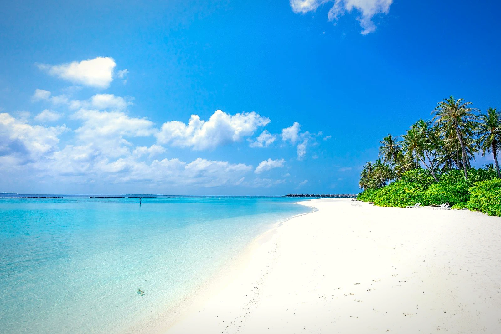 White sand beach and shallow turquoise water at Koh Pakbia
