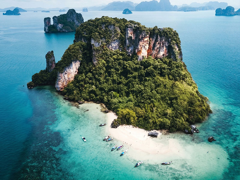 Aerial view of Koh Pakbia showing its long white sand beach and turquoise shallows
